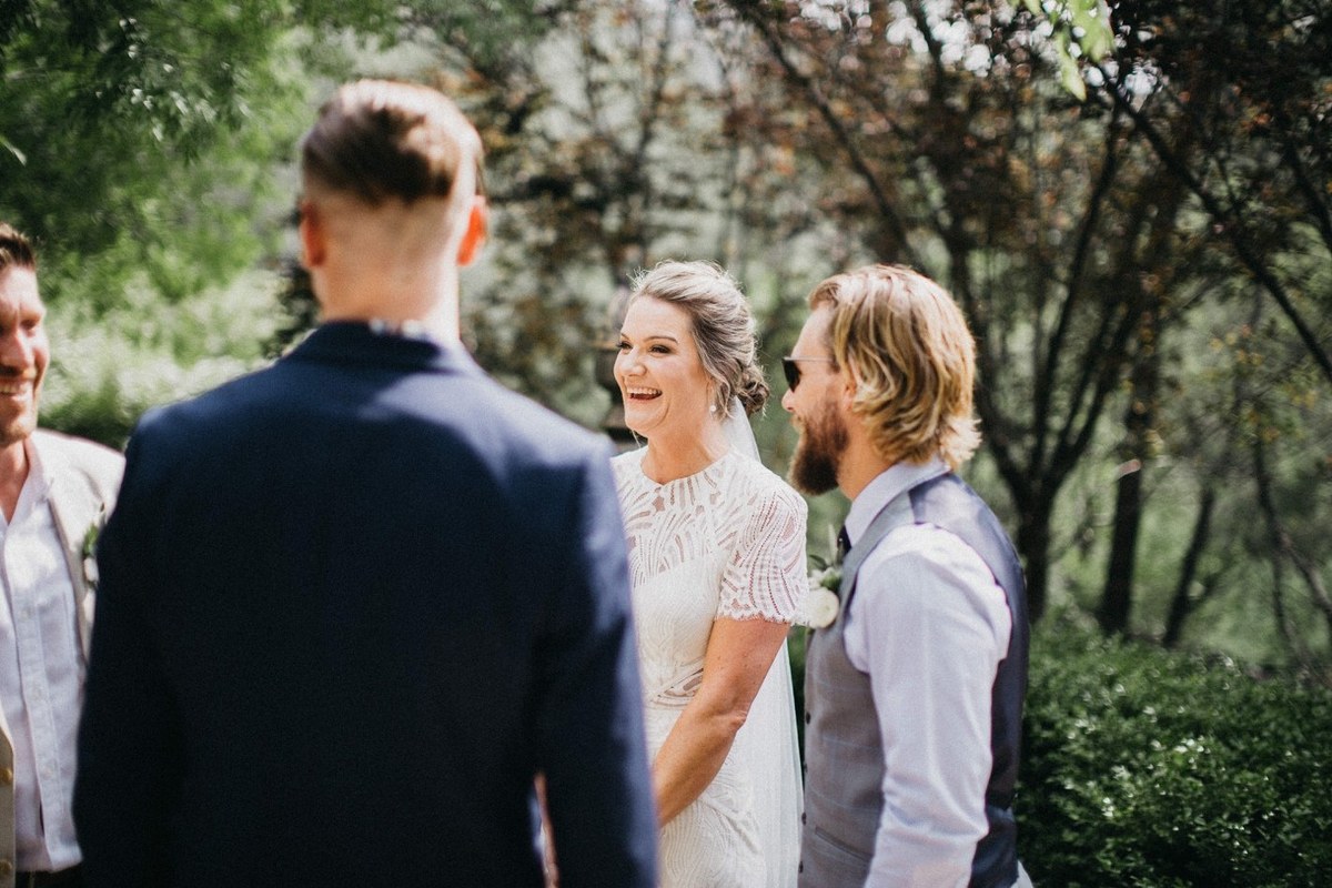The bride and groom greet a guest after the ceremony. Photograph by documentary wedding photographer Joshua Mikhaiel.