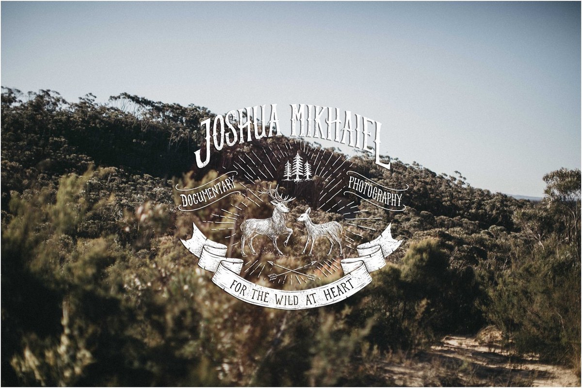 Documentary wedding photographer Joshua Mikhaiel wordmark over a photograph of a rocky hillside.