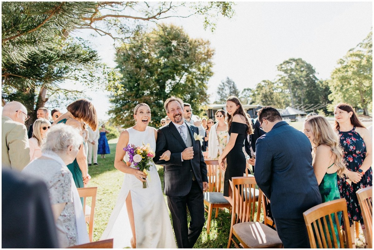 Outdoor ceremony with guests — Joshua Mikhaiel, documentary wedding photographer Wedding guests gather around the bride and groom during an outdoor ceremony. Photograph by documentary wedding photographer Joshua Mikhaiel.