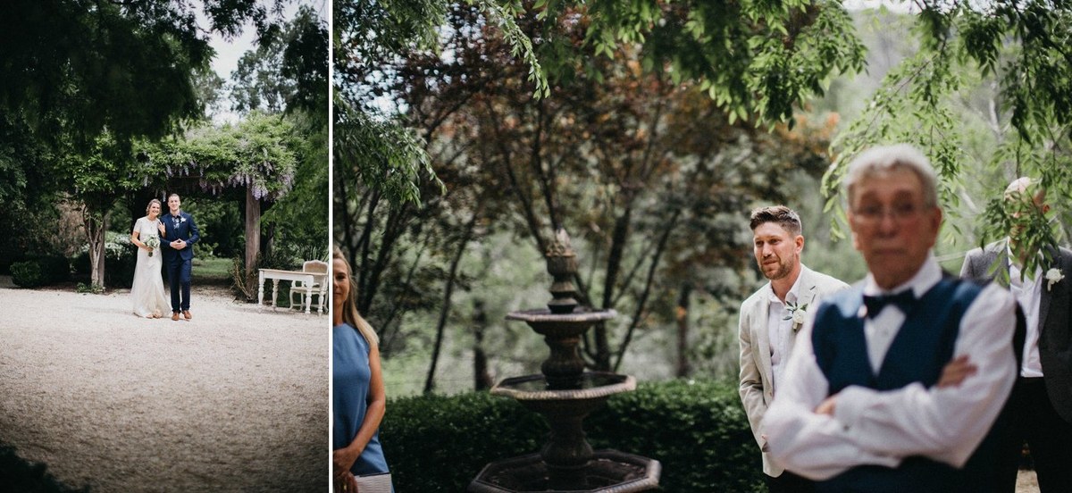 A couple stand beneath a leafy arch in the garden. Photograph by documentary wedding photographer Joshua Mikhaiel.
