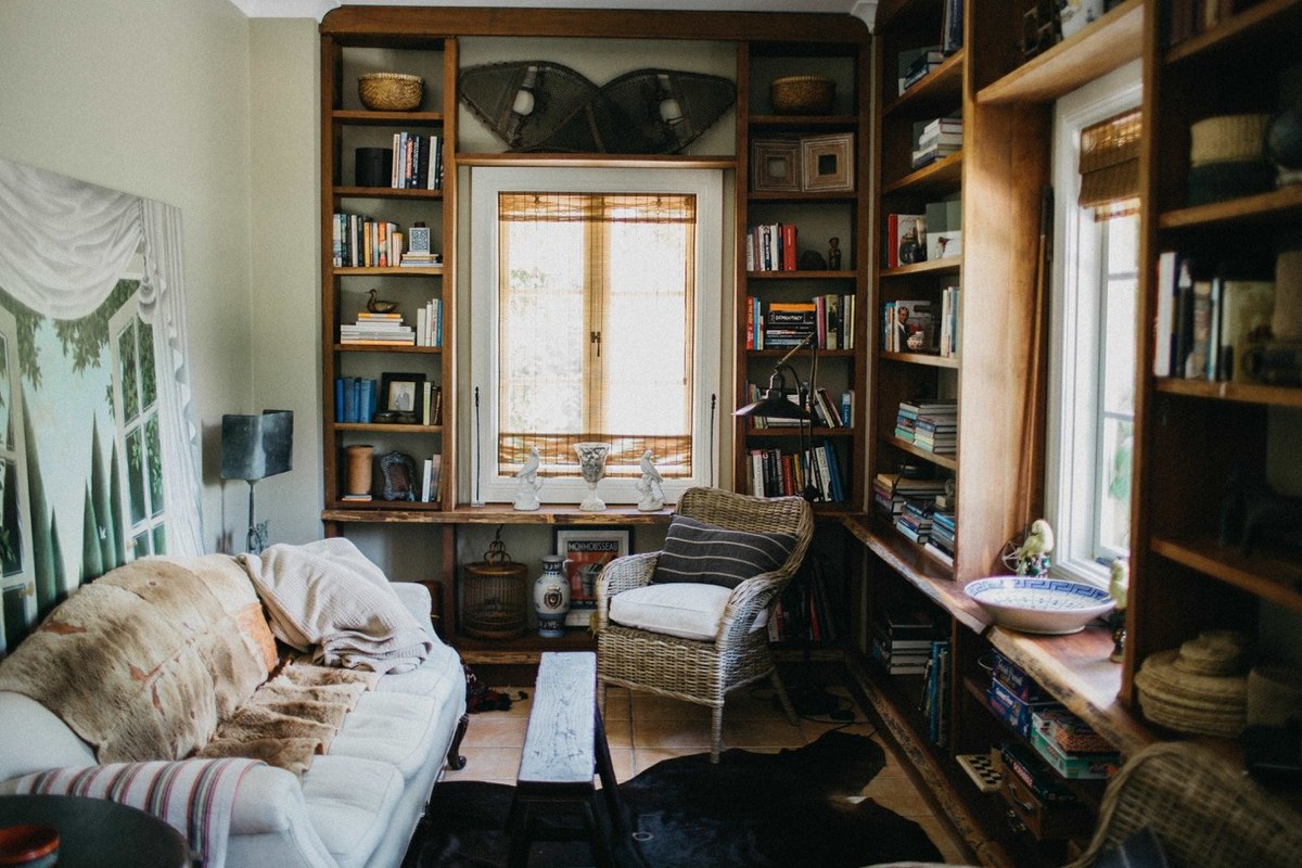A bright library and sitting area open toward the garden. Photograph by documentary wedding photographer Joshua Mikhaiel.