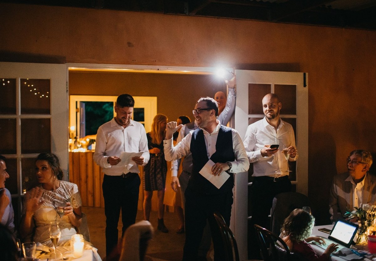 A guest addresses the room during the wedding reception. Photograph by documentary wedding photographer Joshua Mikhaiel.