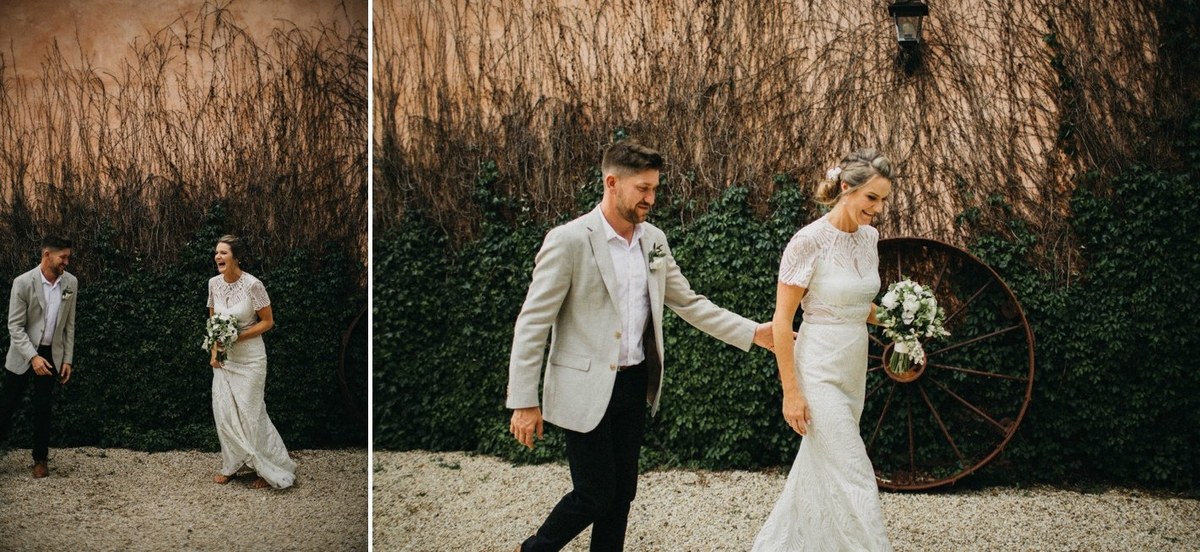 The bride and groom walk together through the field. Photograph by documentary wedding photographer Joshua Mikhaiel.